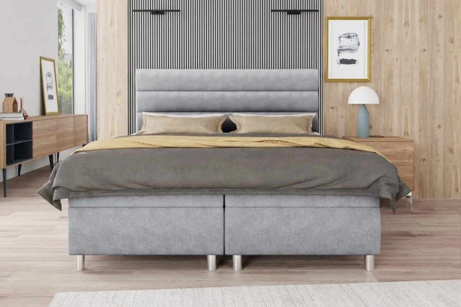 Elegantes Boxspringbett in Grau mit gepolstertem Kopfteil in Frontalansicht
