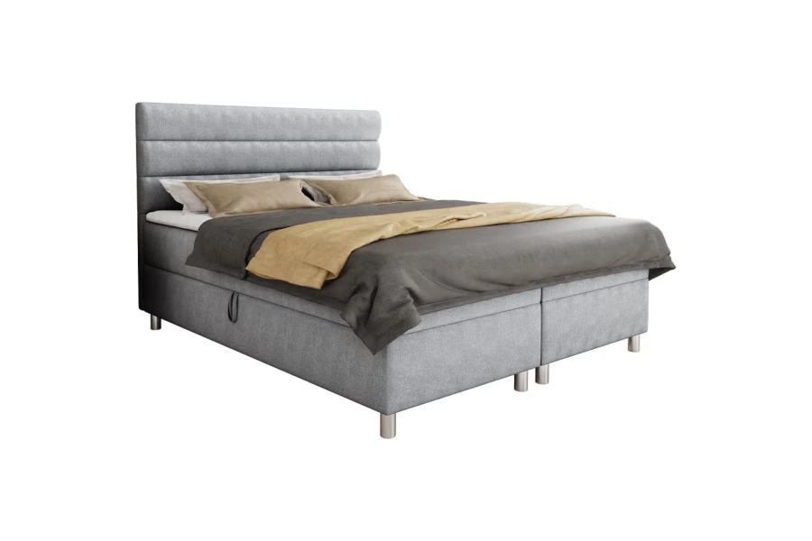 Modernes graues Boxspringbett mit gepolstertem Kopfteil auf weißem Hintergrund.
