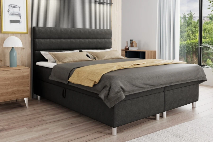 Modernes Boxspringbett in Anthrazit mit gestepptem Kopfteil im Schlafzimmer