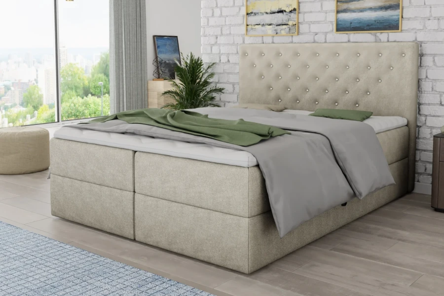 Beiges Boxspringbett mit gestepptem Kopfteil und Glitzersteinen im Schlafzimmer