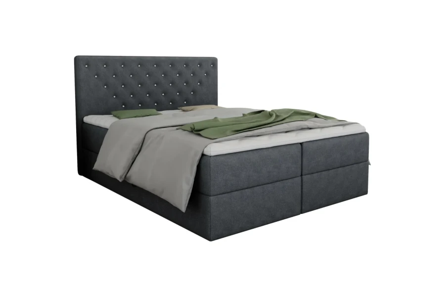 Dunkelgraues Boxspringbett mit kristallverziertem Kopfteil vor weißem Hintergrund.