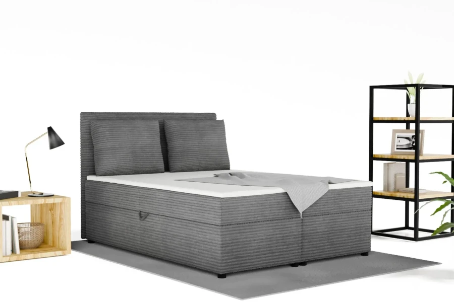 Modernes Boxspringbett in Grau mit Cord-Bezug in einem hellen Schlafzimmer.