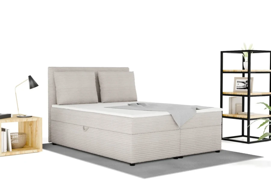 Hellgraues Boxspringbett mit Cord-Bezug und Bettkasten-Funktion in hellem Schlafzimmer.