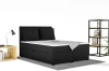 Schwarzes Boxspringbett mit Cord-Bezug in modernem Schlafzimmer.