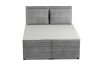 Frontalansicht eines grauen Boxspringbetts mit Cord-Bezug.