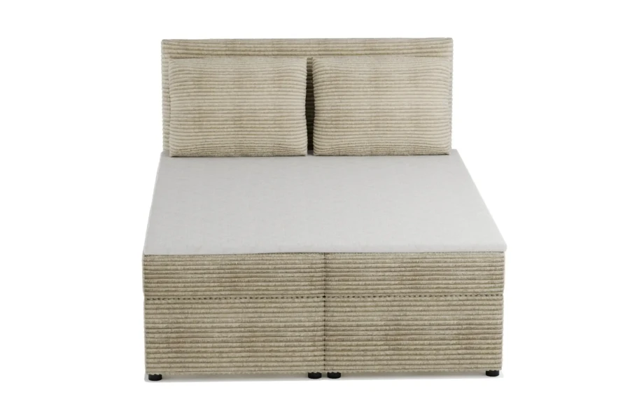Modernes Boxspringbett in Beige aus Cord mit zwei Kissen und Stauraum.
