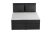 Boxspringbett in Anthrazit aus Cord mit zwei Kissen in der Vorderansicht.