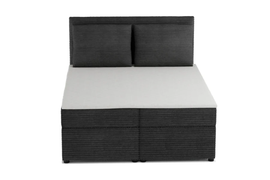 Boxspringbett in Anthrazit aus Cord mit zwei Kissen in der Vorderansicht.