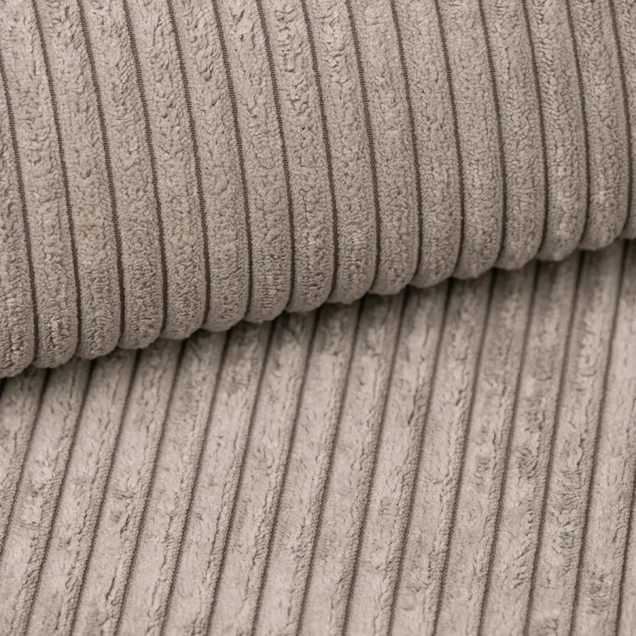 Detailaufnahme des weichen beige-farbenen Cord-Bezugstoffs vom Boxspringbett TAMI.