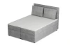 Perspektivische Ansicht des grauen Boxspringbetts TAMI mit strukturierter Cord-Oberfläche.