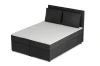 Modernes Boxspringbett in Anthrazit mit weißer Matratze und zwei Kopfkissen.