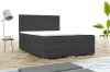 Modern antracietkleurig boxspringbed met gestreept hoofdbord in een lichte slaapkamer.