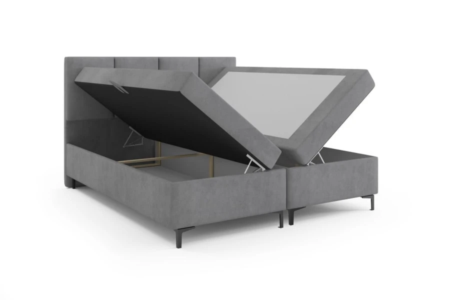 Functioneel boxspringbed in grijs met praktische opbergfunctie in de bedbak.