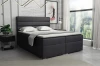 Stijlvol donkergrijs boxspringbed in een moderne slaapkamerambiance.