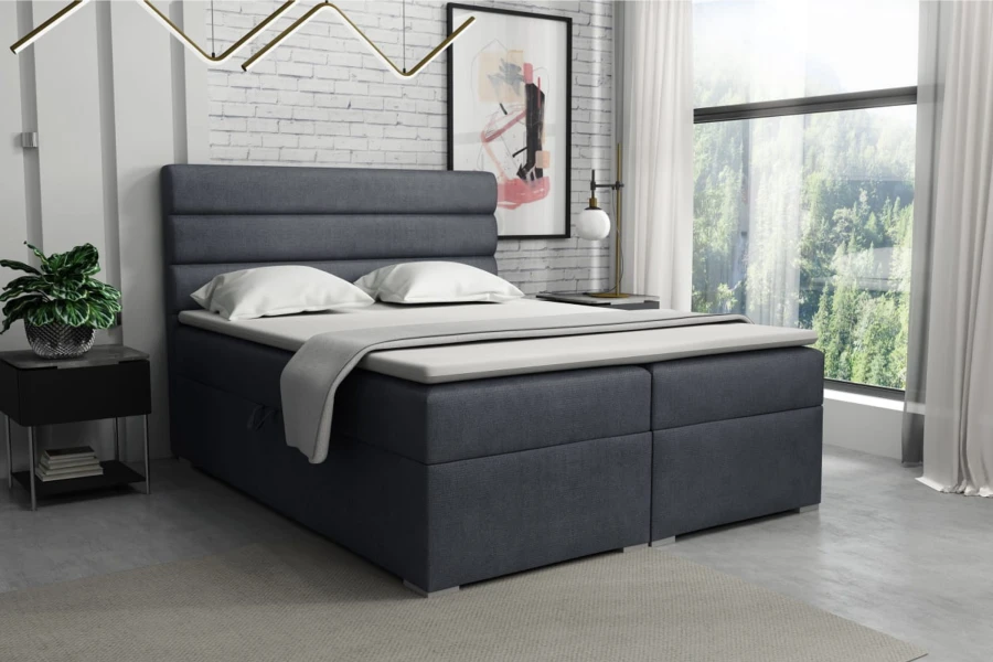 Stijlvol grijs boxspringbed in een modern ingerichte slaapkamerambiance.