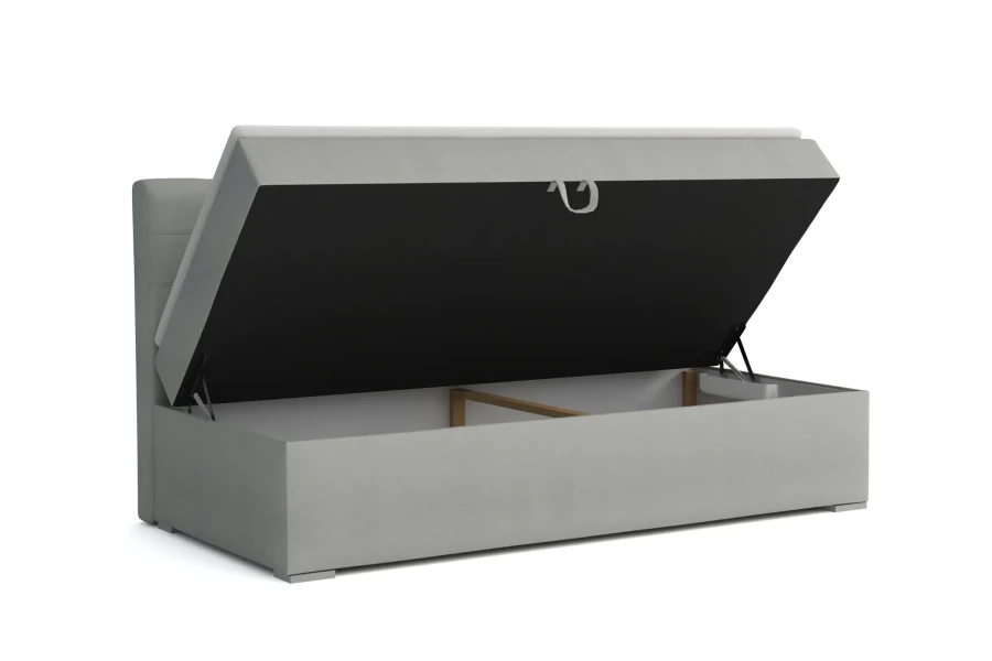 Grey upholstered bed with open bed base for additional storage space.