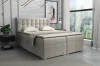 Modern grijs boxspringbed met gecapitonneerd hoofdbord in een lichte slaapkamer