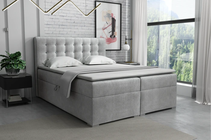 Elegant upholstered bed as a boxspring variant with a quilted headboard in grey-beige.