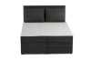 Boxspringbed in antraciet met ribstof bekleding en twee grote hoofdbordkussens, vooraanzicht.