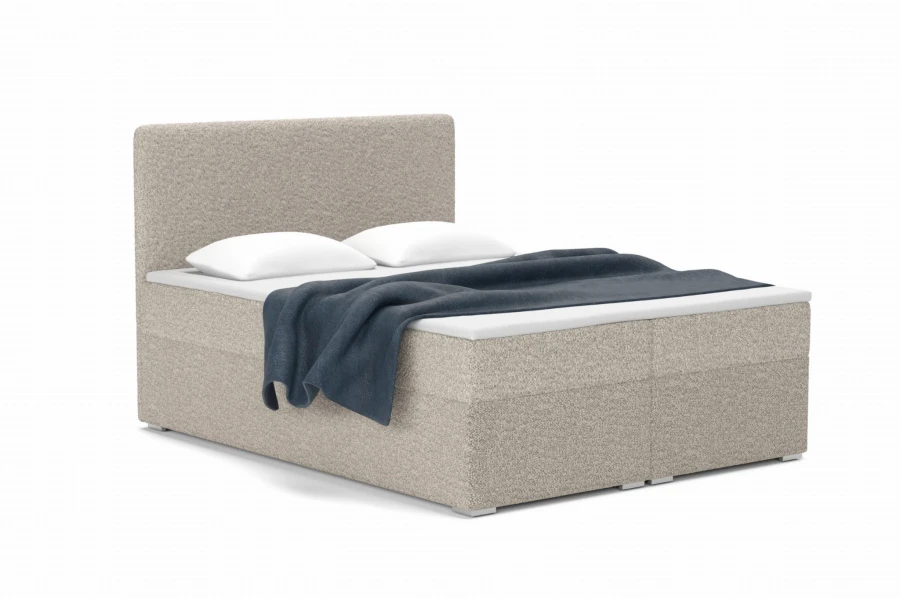 Modernes Bouclé Boxspringbett in Grau mit Kissen und blauer Decke