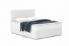 Weißes Boxspringbett mit Bouclé-Stoff, weißen Kissen und blauer Decke.