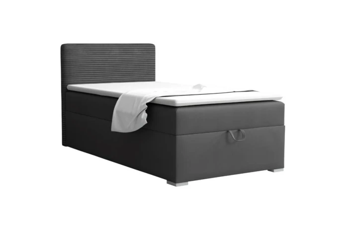 Grey single bed in corduroy look with white topper, isolated against a white background.