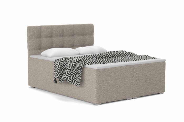 Modernes Boxspringbett in Beige mit gestepptem Kopfteil und gemusterter Decke