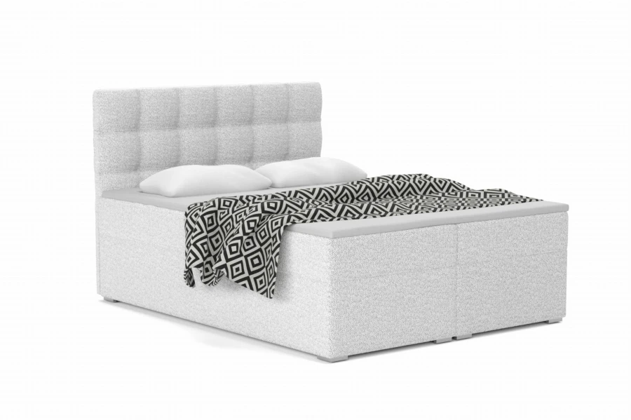 Elegantes Boxspringbett in Weiß mit weichem Kopfteil und schwarz-weißer Tagesdecke