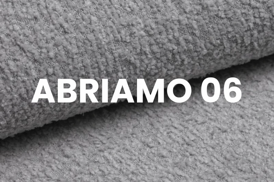 Abriamo 06 hellgrauer Bouclé-Stoff, Detailaufnahme der Polstermöbel-Textur.