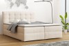 Beiges Boxspringbett Florida in modernem Schlafzimmer mit Weltkarte und hellen Möbeln.