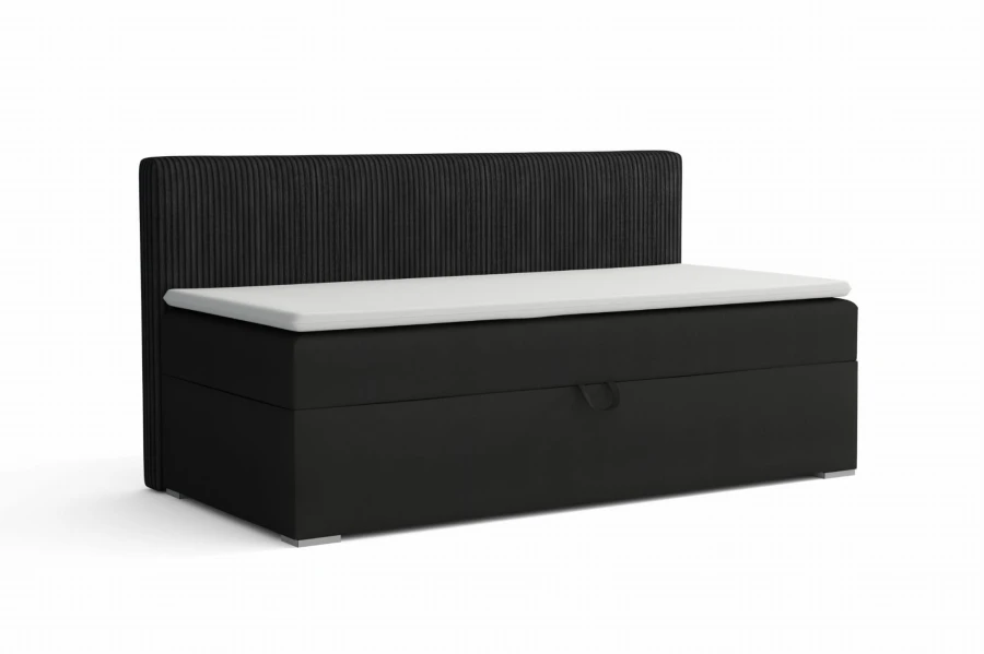 Schwarzes Polsterbett mit Bettkasten, Cord-Struktur am Kopfteil und weißer Matratze.