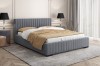 Anthrazitfarbenes Polsterbett in stilvollem Schlafzimmer-Ambiente mit edler Dekoration.