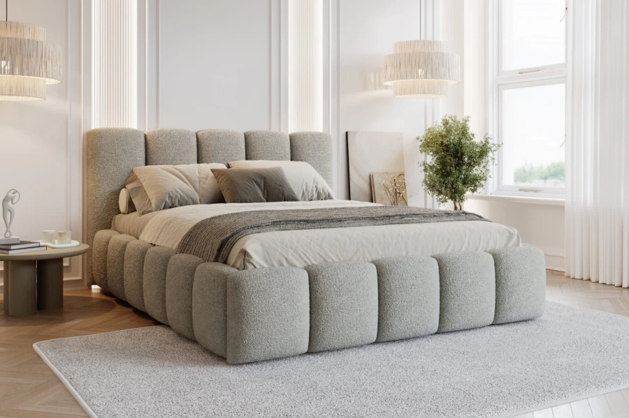 Stilvolles graues Polsterbett aus strukturiertem Bouclé-Stoff im hellen Schlafzimmer.