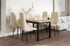 Eingerichtetes Esszimmer mit Holztisch, beigen Stühlen und modernem Wohnambiente.