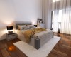 Modernes Schlafzimmer-Set mit grauem Bett, Nachttisch und weißem Teppich auf Parkettboden.