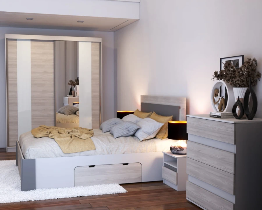 Funktionsbett mit Bettkasten, passende Kommode und Schiebetürenschrank im modernen Schlafzimmer-Design.