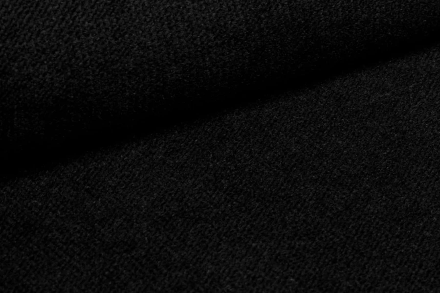 Detailansicht schwarzer Strukturstoff für Polstermöbel.