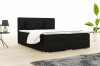 Schwarzes Boxspringbett mit weißer Bettwäsche und zwei Kissen.