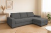 Modernes Ecksofa in Grau mit Cord-Struktur in einem hellen, minimalistischen Wohnzimmer.