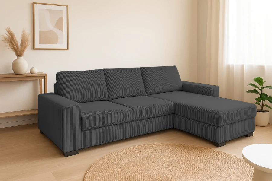 Dunkelgraues Ecksofa aus Cord in einem hellen, minimalistischen Wohnzimmer mit Jute-Teppich.