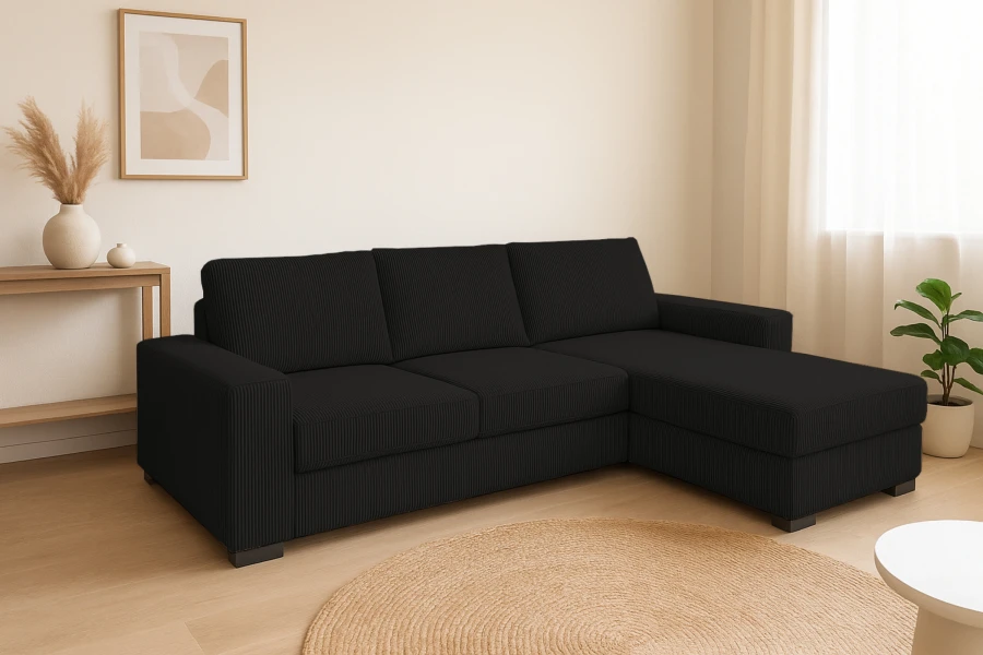 Schwarzes Ecksofa mit Cordbezug in minimalistischem Wohnzimmer-Ambiente mit Natur-Deko.