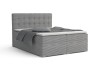 Graues Boxspringbett in Cord-Optik mit gepolstertem Kopfteil und grauer Bettwäsche.