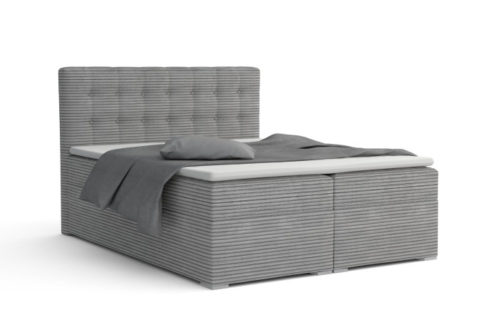 Graues Boxspringbett mit Cord-Bezug, gestepptem Kopfteil und grauer Bettwäsche auf weißem Hintergrund.