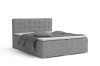 Graues Boxspringbett mit Cord-Bezug und gestepptem Kopfteil, modernes Schlafzimmer-Design.