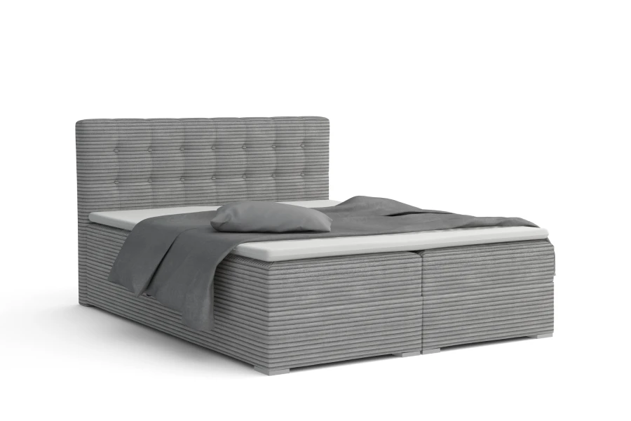 Graues Boxspringbett aus Cord mit gestepptem Kopfteil und grauer Bettwäsche