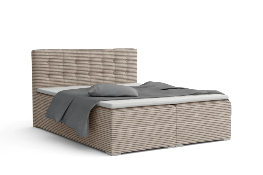 Hellbraunes Boxspringbett mit Cord-Struktur und stilvollem Kopfteil auf weißem Hintergrund.