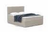 Modern box spring bed in beige with fabric cover, cushions and blue blanket.