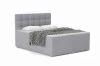 Modern grey boxspring bed with quilted headboard, cushions and duvet.