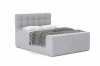 Compleet gestoffeerd bed in grijs met kussens en gedessineerde deken