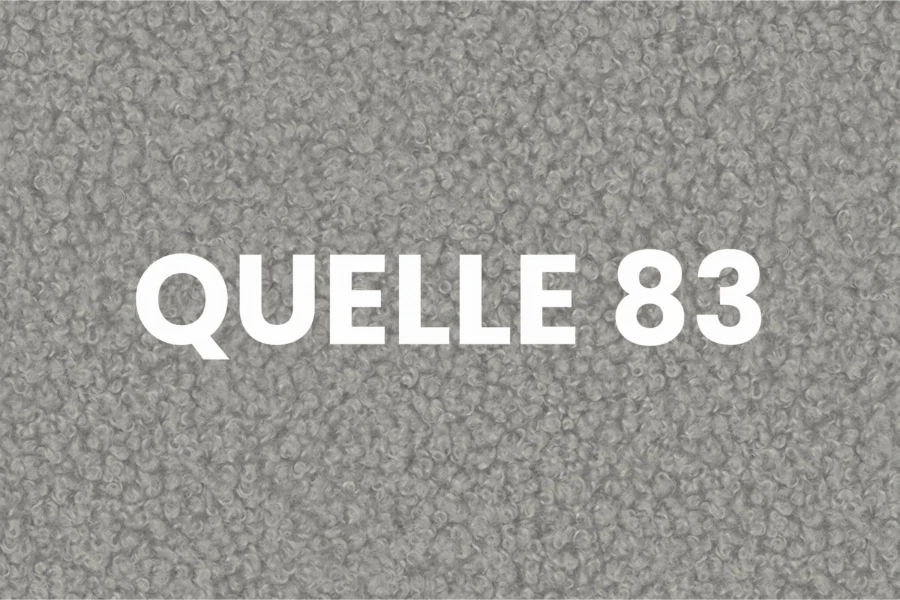 Nahaufnahme der grauen Bouclé-Stoffstruktur QUELLE 83 für hochwertige Polstermöbel.